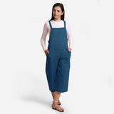 Front View of a Model wearing Teal Pinafore Midi Length Dungaree