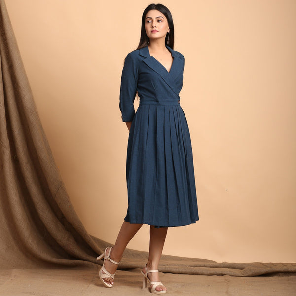 Right View of a Model wearing Teal Pleated Knee Length Wrap Dress