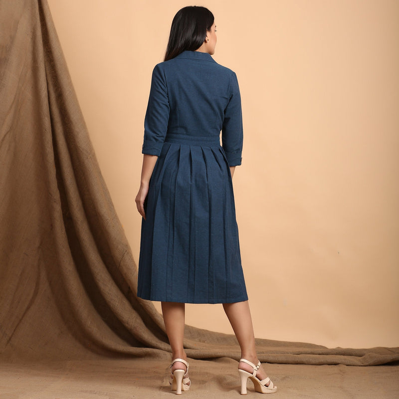 Back View of a Model wearing Teal Pleated Knee Length Wrap Dress