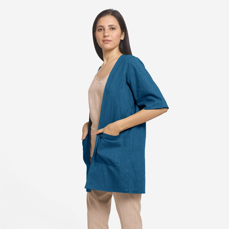 Left View of a Model wearing Teal Reversible Cotton Flax Front Open Overlay