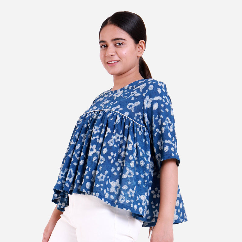 Left View of a Model wearing Natural Dyed Dabu Printed Gathered Top