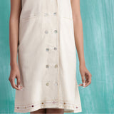 Front Detail of a Model wearing Off-White Handspun Cotton Muslin Button-Down Short Dress
