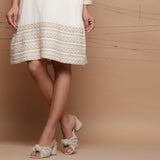 Close View of a Model wearing Undyed Ecru Handspun Cotton Muslin Knee Length A-Line Dress
