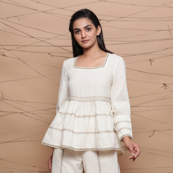 Front View of a Model wearing Undyed Cotton Jute Laced Peplum Top