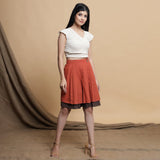 Right View of a Model wearing Undyed Raglan Top and Reversible Skirt Set