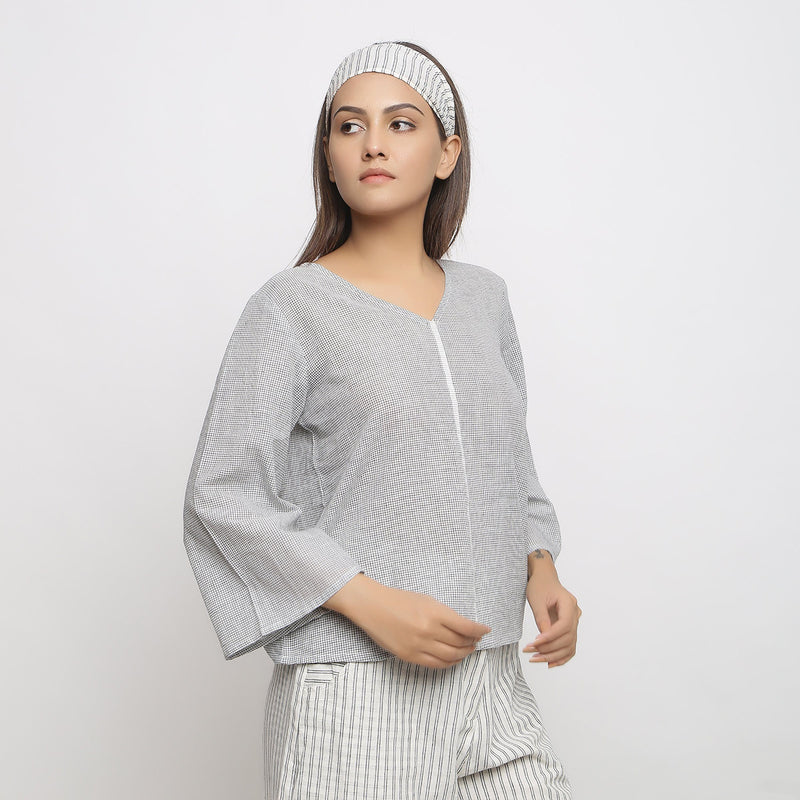 Right View of a Model wearing Off-White Handwoven Cotton V-Neck Top
