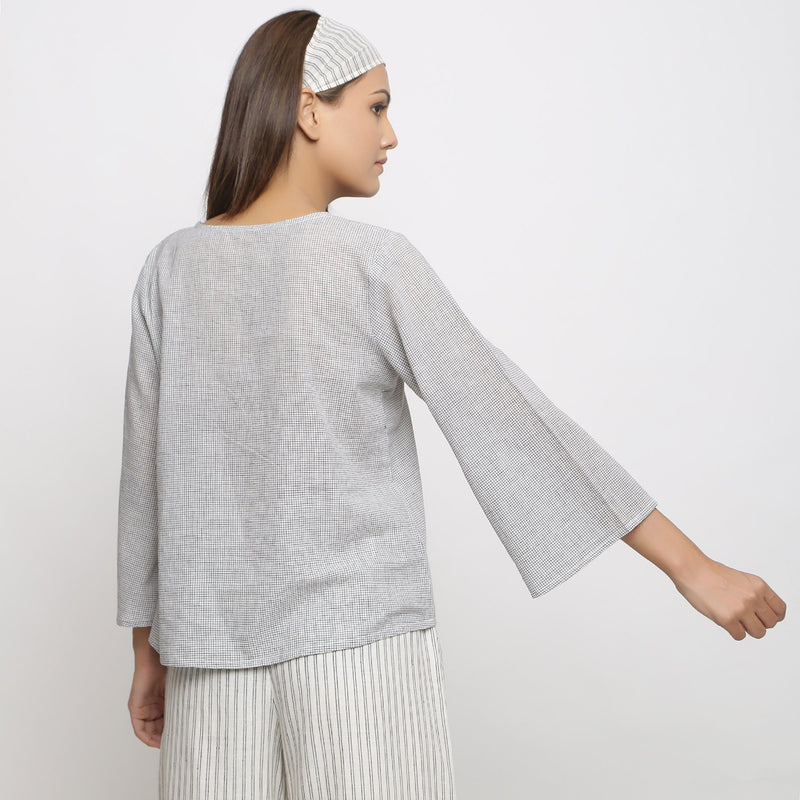 Back View of a Model wearing Off-White Handwoven Cotton V-Neck Top