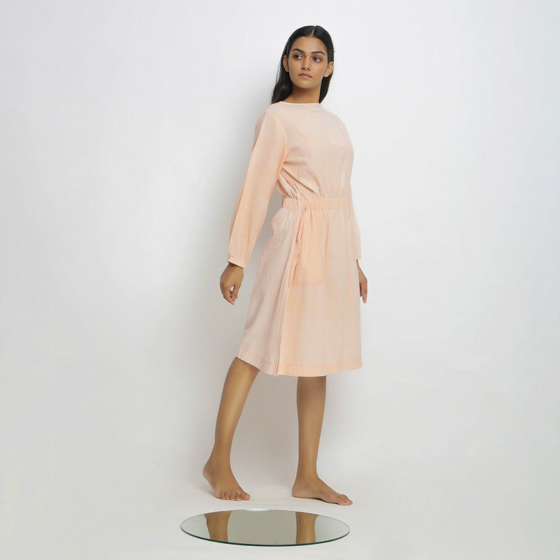 Right View of a Model wearing Vegetable Dyed Bishop Sleeves Dress