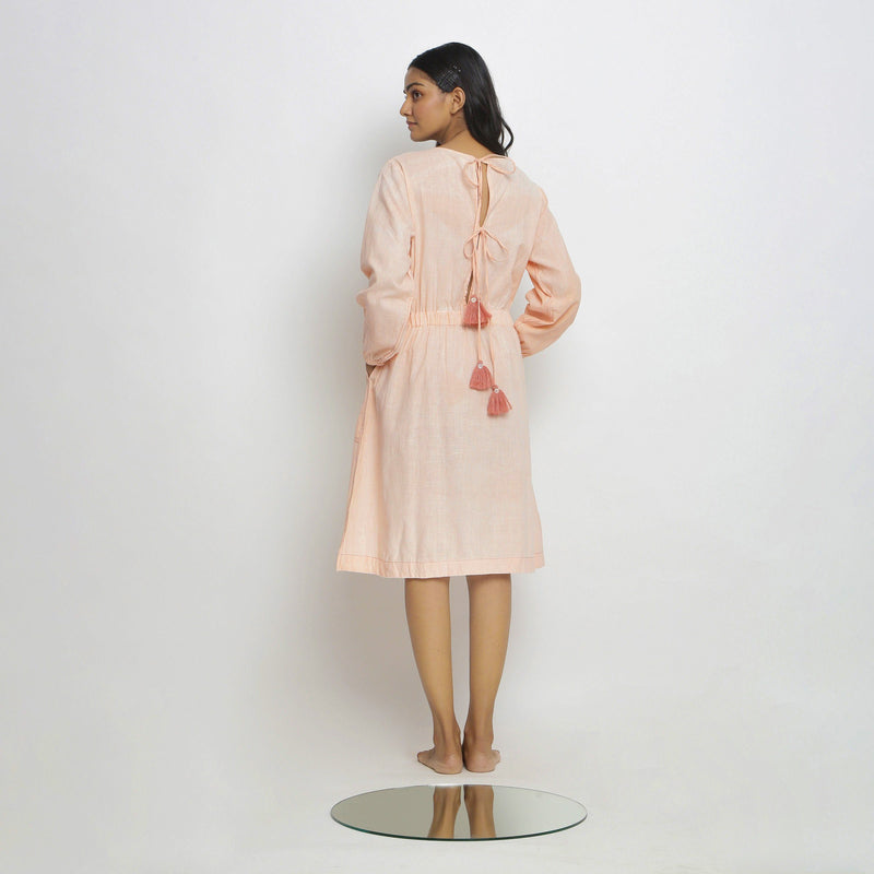 Back View of a Model wearing Vegetable Dyed Bishop Sleeves Dress