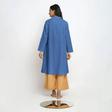 Back View of a Model wearing Vegetable Dyed Blue Paneled Cotton Overlay
