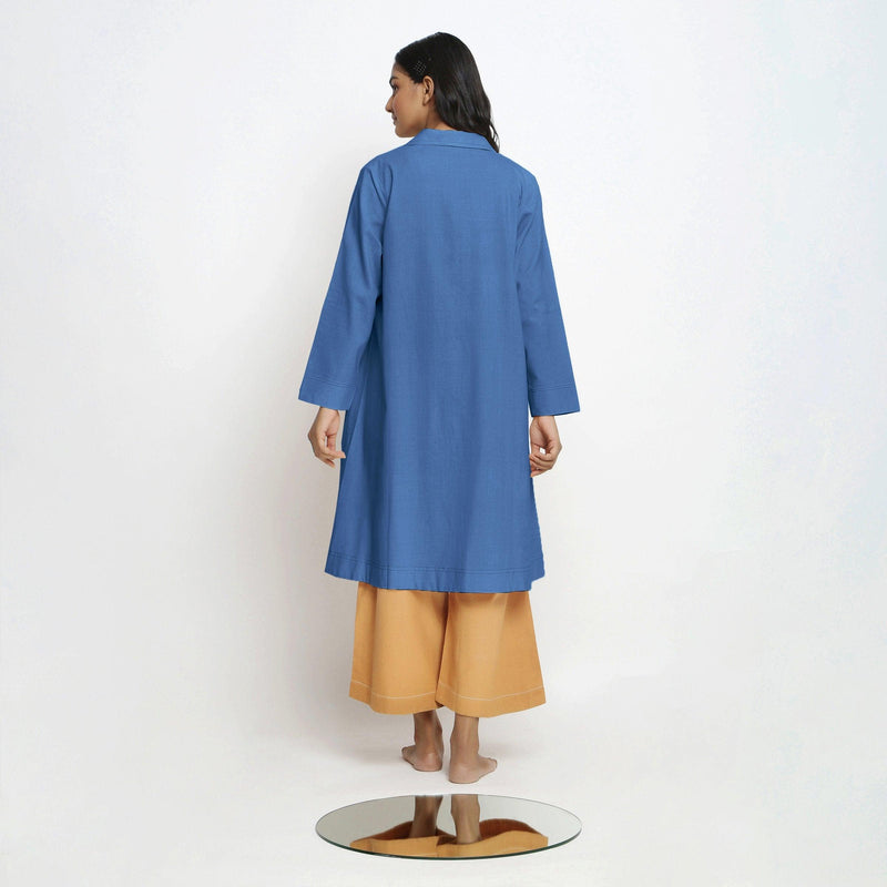 Back View of a Model wearing Vegetable Dyed Blue Paneled Cotton Overlay