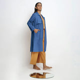 Right View of a Model wearing Vegetable Dyed Blue Paneled Cotton Overlay