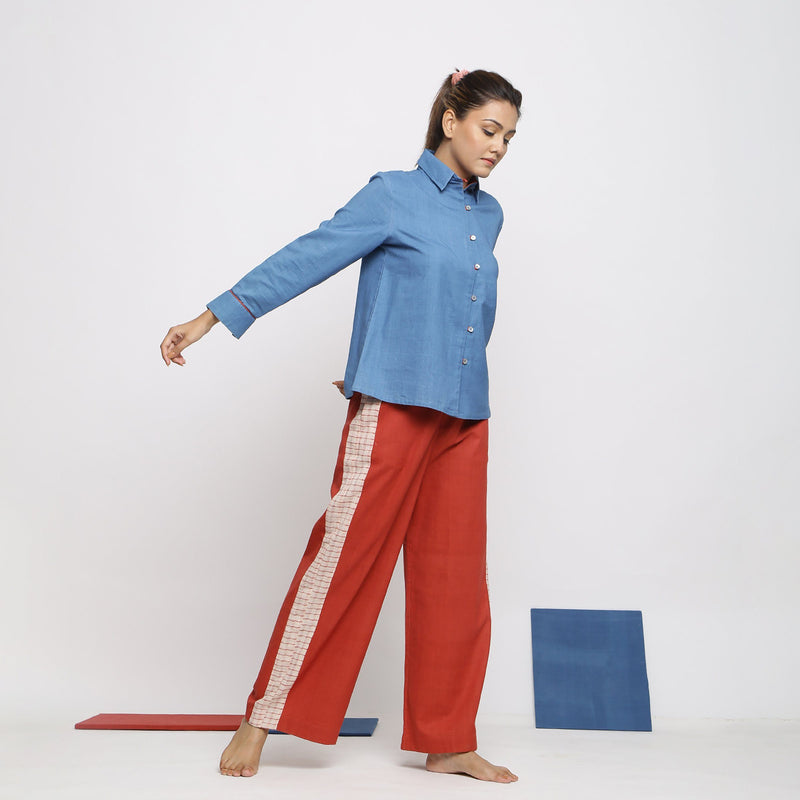 Right View of a Model wearing Vegetable Dyed Blue Shirt and Brick Red Pant Set