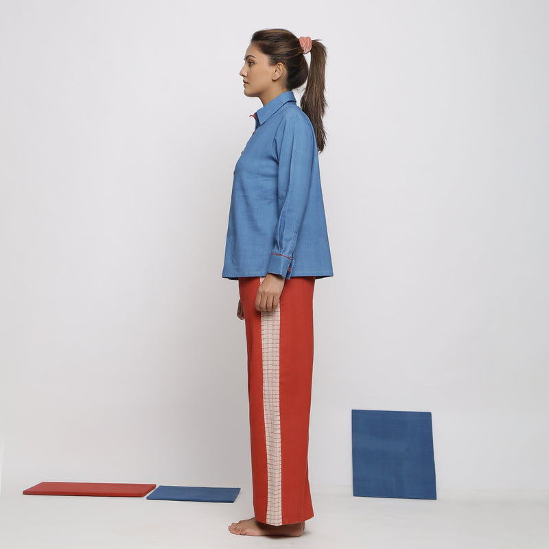 Left View of a Model wearing Vegetable Dyed Blue Shirt and Brick Red Pant Set