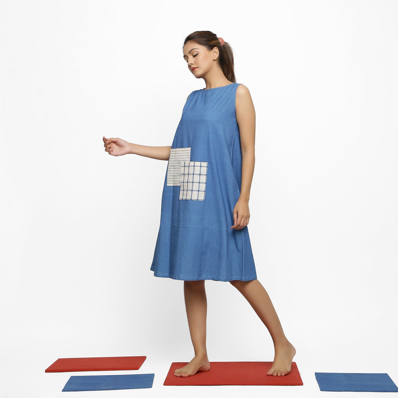Left View of a Model wearing Vegetable Dyed Handspun Cotton Blue A-Line Knee-Length Dress
