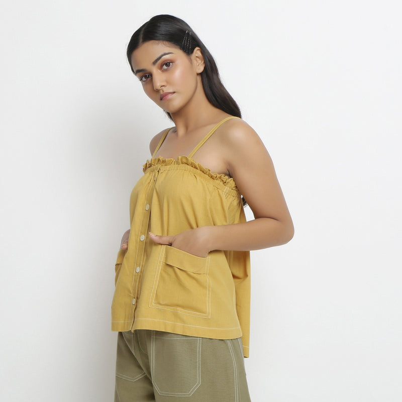 Left View of a Model wearing Light Yellow Patch Pocket Vegetable Dyed Handspun Cotton Camisole Top