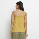 Back View of a Model wearing Light Yellow Patch Pocket Vegetable Dyed Handspun Cotton Camisole Top