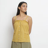 Front View of a Model wearing Light Yellow Patch Pocket Vegetable Dyed Handspun Cotton Camisole Top
