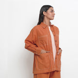 Right View of a Model wearing Rust Vegetable Dyed Handspun Cotton Button-Down Jacket