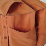 Front Detail of a Model wearing Rust Vegetable Dyed Handspun Cotton Button-Down Jacket