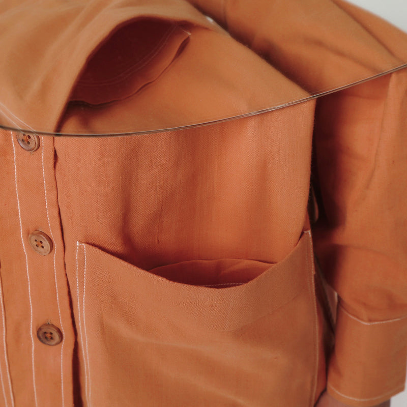Front Detail of a Model wearing Rust Vegetable Dyed Handspun Cotton Button-Down Jacket
