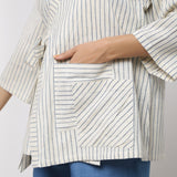 Front Detail of a Model wearing Off-White and Blue Striped Handspun Cotton Asymmetrical V-Neck Outerwear