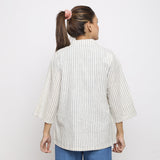 Back View of a Model wearing Off-White and Blue Striped Handspun Cotton Asymmetrical V-Neck Outerwear