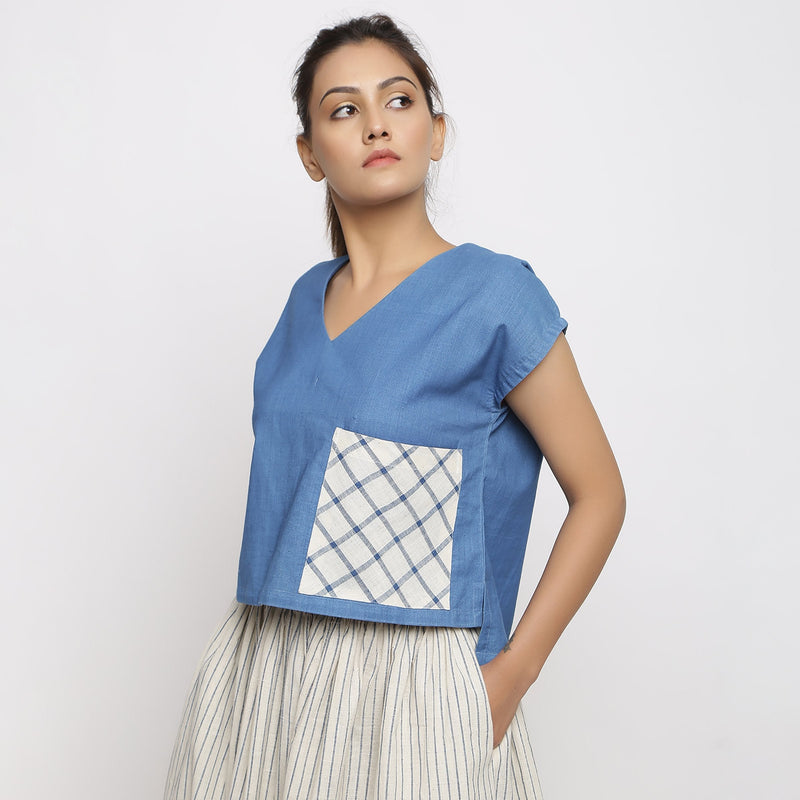 Left View of a Model wearing Blue Vegetable Dyed Handspun Cotton V-Neck High-Low Top