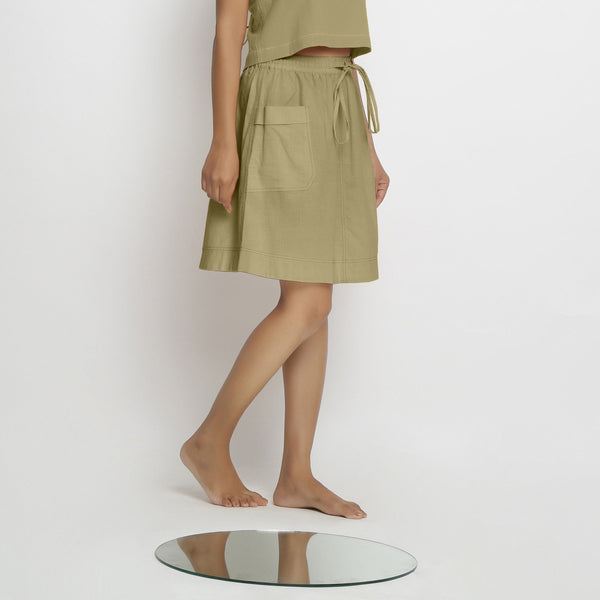 Right View of a Model wearing Vegetable-Dyed Green 100% Cotton Mid-Rise Skirt