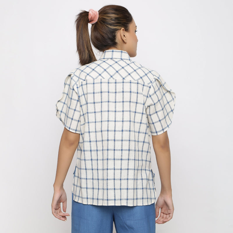 Back View of a Model wearing Off-White and Blue Vegetable Dyed Cotton Checkered Peter Pan Collar Shirt