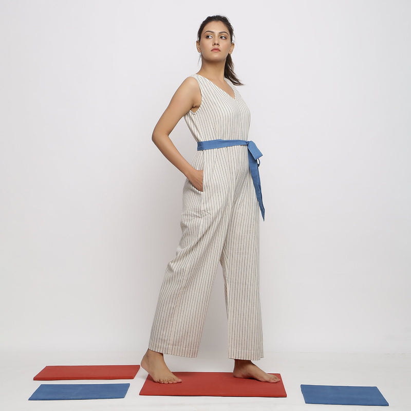 Right View of a Model wearing Ecru and Blue Striped Vegetable Dyed Cotton Sleeveless Jumpsuit
