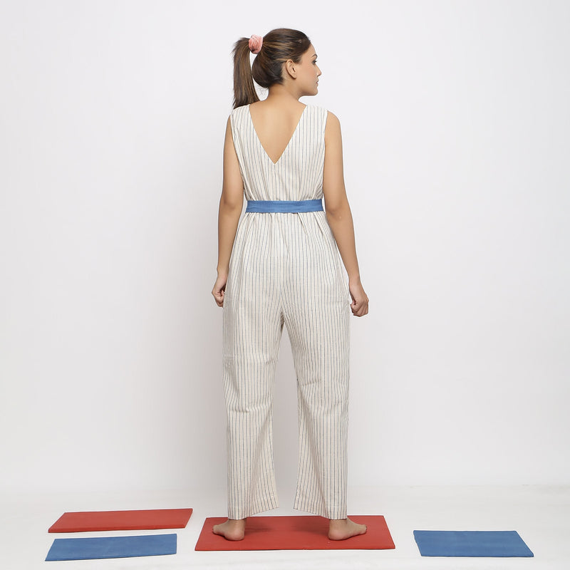 Back View of a Model wearing Ecru and Blue Striped Vegetable Dyed Cotton Sleeveless Jumpsuit