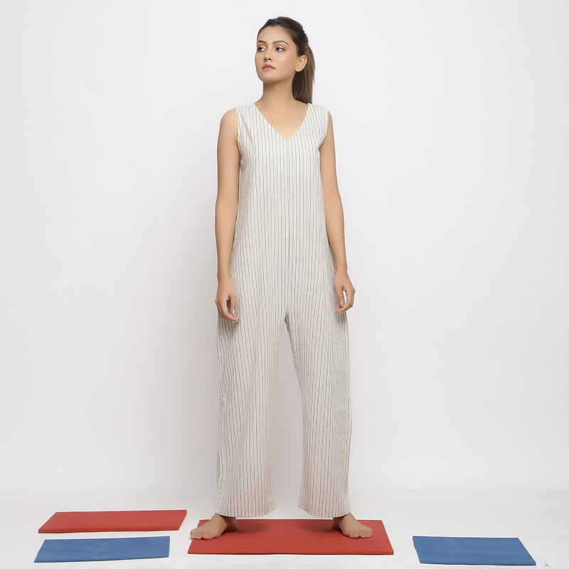 Front View of a Model wearing Ecru and Blue Striped Vegetable Dyed Cotton Sleeveless Jumpsuit