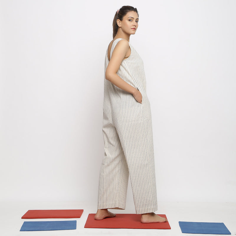 Back View of a Model wearing Ecru and Blue Striped Vegetable Dyed Cotton Sleeveless Jumpsuit