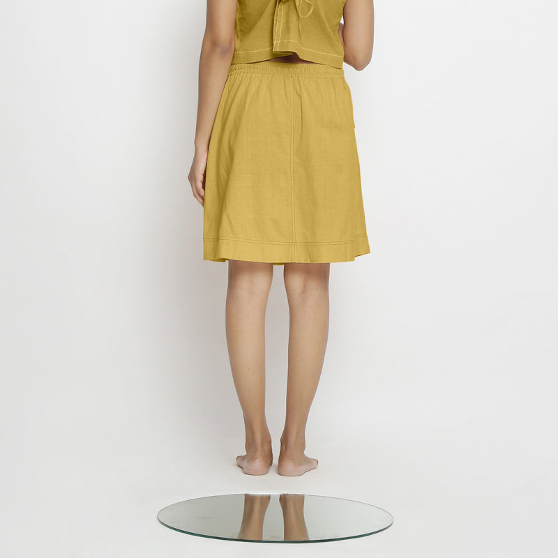 Back View of a Model wearing Vegetable-Dyed Light Yellow 100% Cotton Mid-Rise Skirt