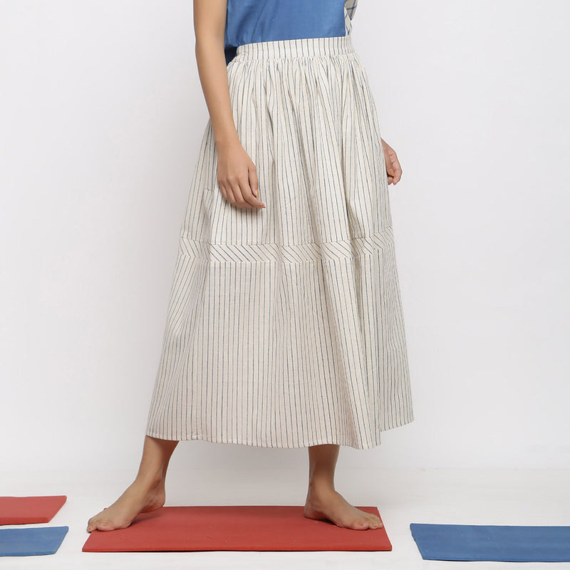 Front View of a Model wearing Off-White and Blue Striped Yarn Dyed Cotton Gathered Maxi Skirt