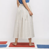 Back View of a Model wearing Off-White and Blue Striped Yarn Dyed Cotton Gathered Maxi Skirt