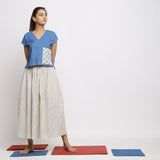 Front View of a Model wearing Off-White and Blue Striped Yarn Dyed Cotton Gathered Maxi Skirt