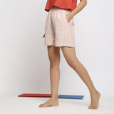 Left View of a Model wearing Off-White and Pink Checks Yarn-Dyed Cotton Paneled Shorts