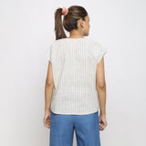 Back View of a Model wearing Vegetable Dyed Off-White Straight Top