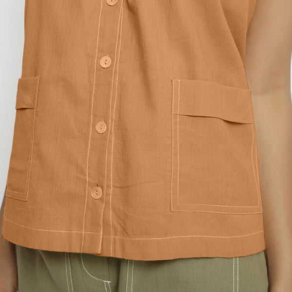 Front Detail of a Model wearing Vegetable-Dyed Orange 100% Cotton Button-Down Top
