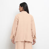 Back View of a Model wearing Vegetable Dyed Pink Button-Down Outerwear