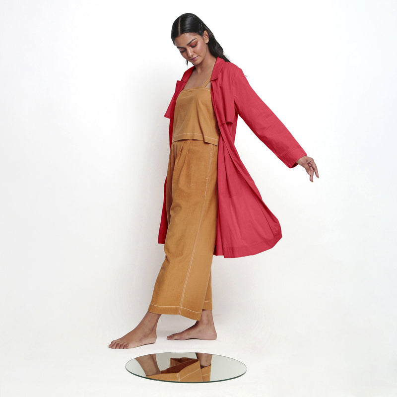 Left View of a Model wearing Vegetable Dyed Red Paneled Cotton Overlay