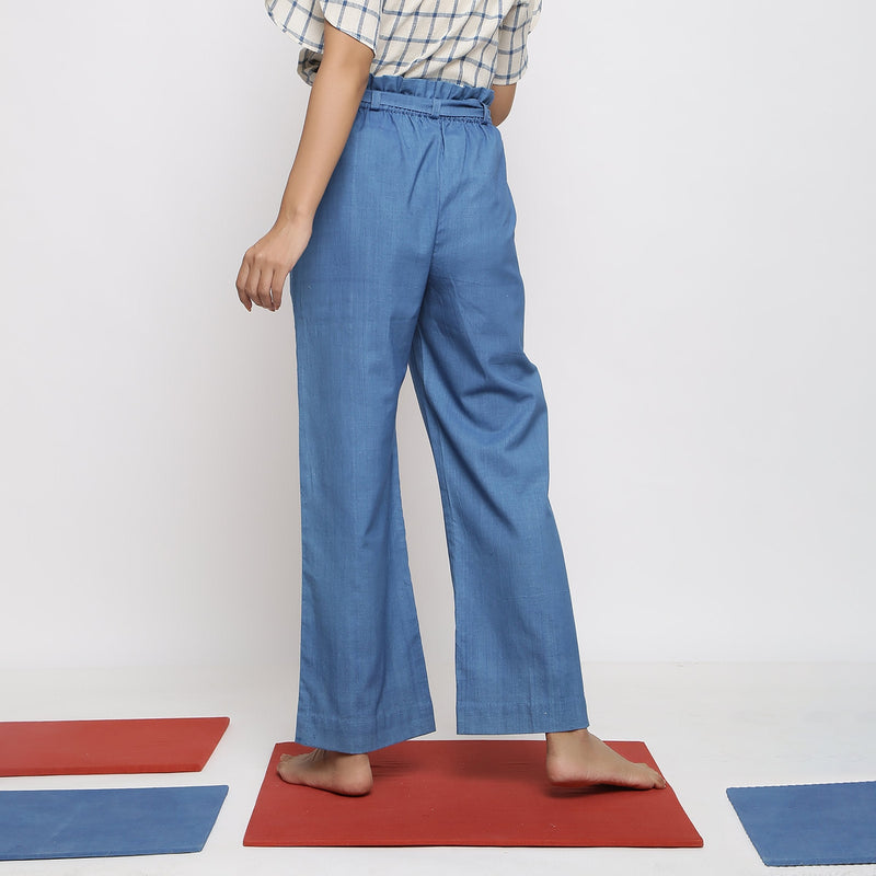 Back View of a Model wearing Blue Vegetable Dyed Cotton Paperbag Elasticated Wide Legged Pant