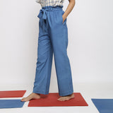 Left View of a Model wearing Blue Vegetable Dyed Cotton Paperbag Elasticated Wide Legged Pant