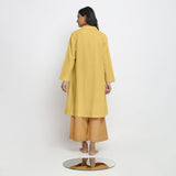 Back View of a Model wearing Vegetable-Dyed Yellow 100% Cotton Paneled Overlay