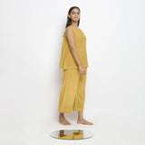Right View of a Model wearing Vegetable Dyed yellow Boat Neck A-Line Top