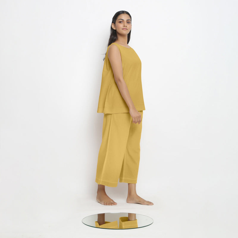 Right View of a Model wearing Vegetable Dyed yellow Boat Neck A-Line Top