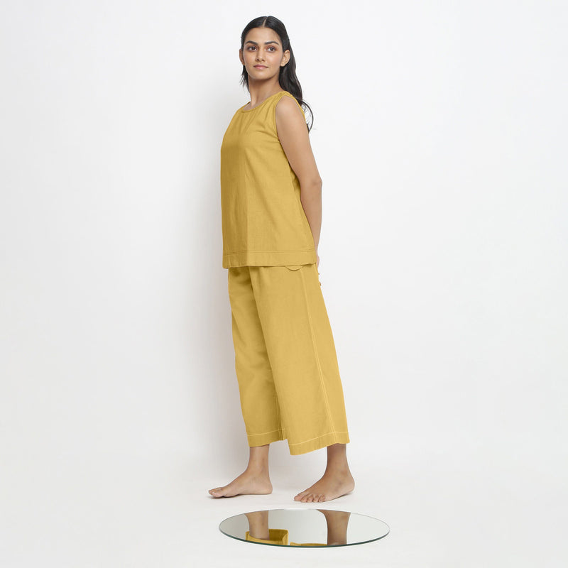 Left View of a Model wearing Vegetable Dyed yellow Boat Neck A-Line Top