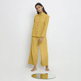 Front View of a Model wearing Vegetable Dyed Yellow Button-Down Cotton Top